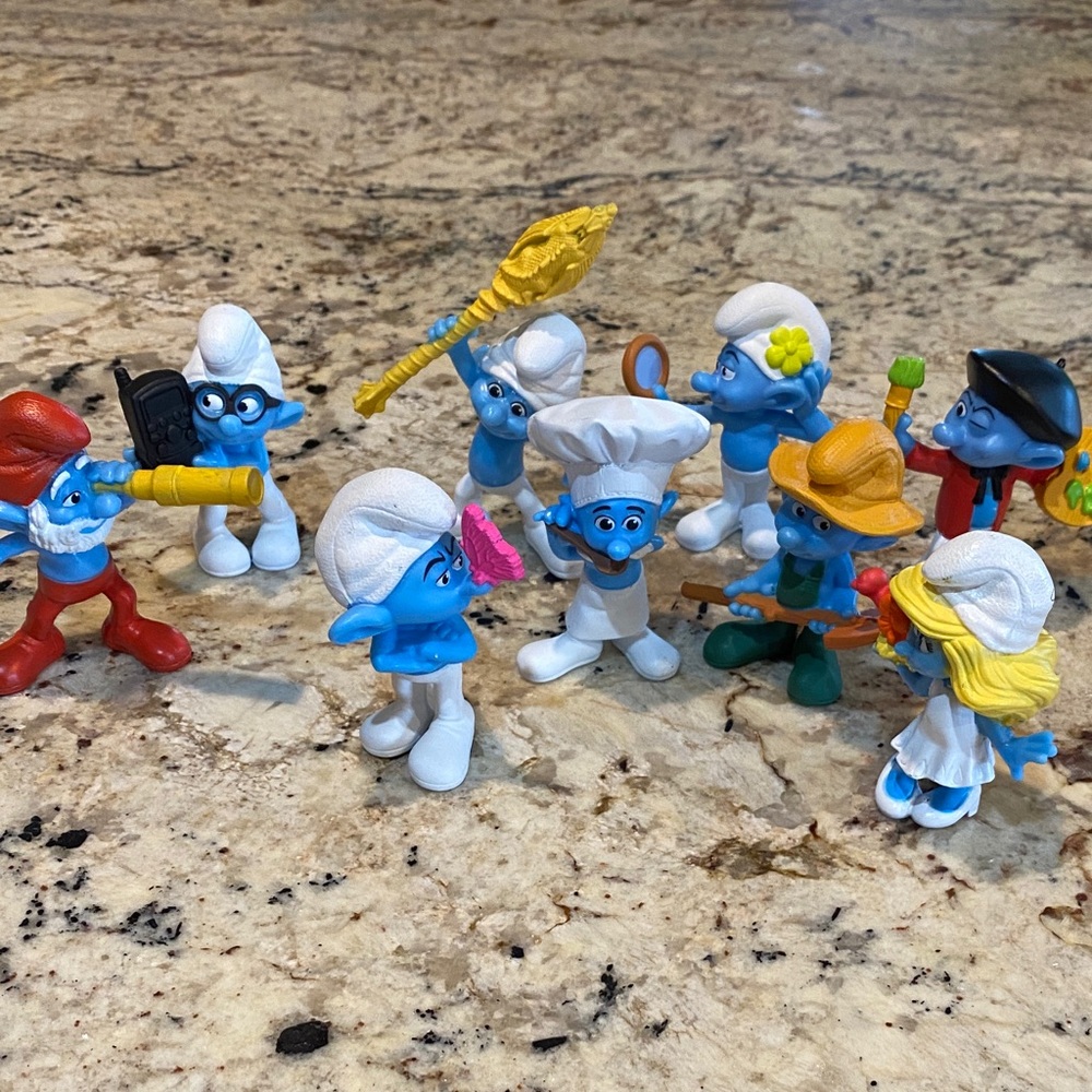 McDonald's Blue Smurf Figurine Set with White Hats and Colorful Accessories